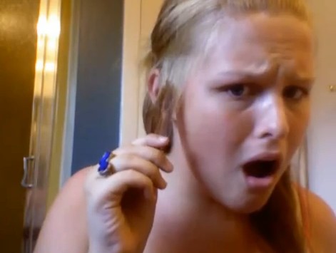 Girl burns her hair off while trying to make curling instructional video
