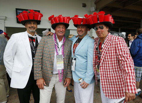 Attendees wear matching elaborate hats before the running of the 139th Kentucky Derby horse race at Churchill Downs in Louisville