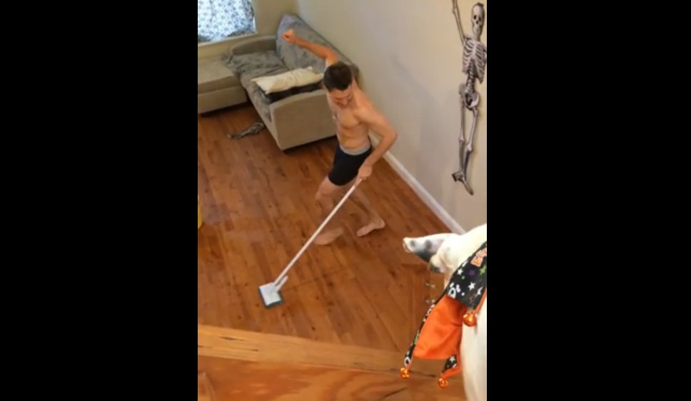 guy catches roommate dancing cleaning
